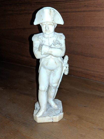 A 19th century French carved ivory figure of Napoleon, height 6.1in.